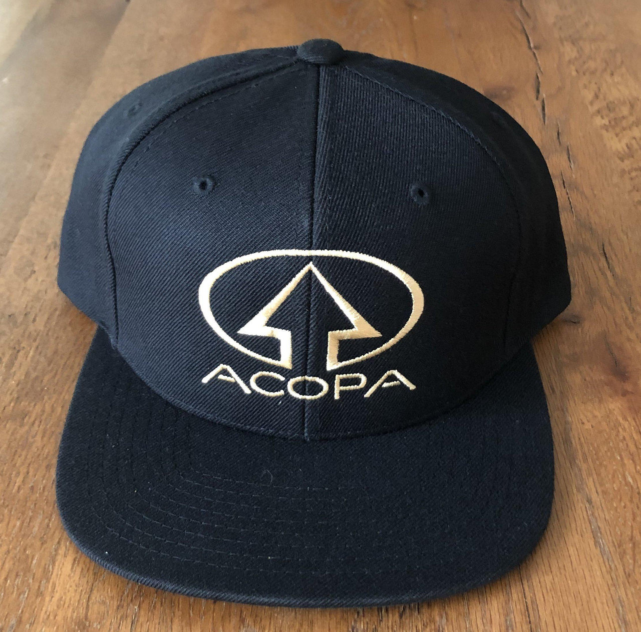 Black Acopa Hat with Gold Embroidered Logo